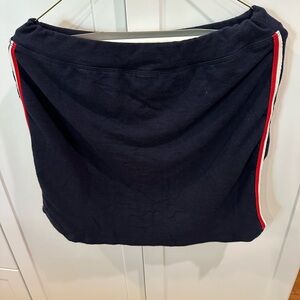 Brand new Sundry skirt navy blue with red and white piping on the side